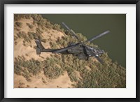 An AH-64D Apache Helicopter in Flight Fine Art Print