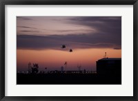 A pair of UH-60 Black Hawk helicopters approach their Landing in Baghdad, Iraq Fine Art Print