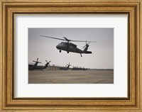 A UH-60 Black Hawk Taking off for a Mission Over Northern Iraq Fine Art Print