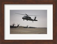 A UH-60 Black Hawk Taking off for a Mission Over Northern Iraq Fine Art Print