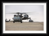 UH-60 Black Hawks taxis out for a mission over northern Iraq Fine Art Print