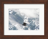 Rear view of the Three main Engines of Space Shuttle Discovery as the Shuttle approaches the International Space Station Fine Art Print
