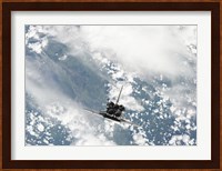 Rear view of the Three main Engines of Space Shuttle Discovery as the Shuttle approaches the International Space Station Fine Art Print