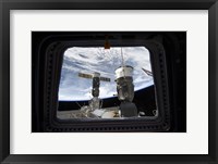 Two Russian Spacecraft Docked with the International Space Station, as seen from Space Shuttle Discovery's Flight Deck Window Fine Art Print