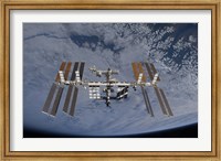 International Space Station set against the background of a cloud covered Earth Fine Art Print