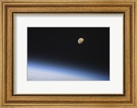 A Gibbous Moon Visible above Earth's Atmosphere Fine Art Print