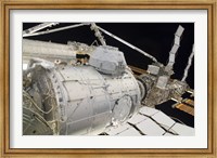 The Pressurized Mating Adapter 3 in the Grasp of the Canadarm2 Fine Art Print