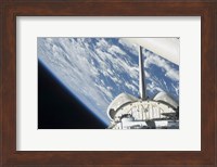 Partial view of Space Shuttle Endeavour Backdropped against Earth Fine Art Print