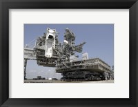 The mobile Launcher Platform is being moved via the Crawler-Transporter Underneath Fine Art Print
