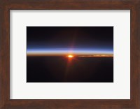 Layers of Earth's atmosphere, brightly colored as the sun sets over South America Fine Art Print