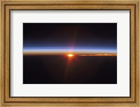 Layers of Earth's atmosphere, brightly colored as the sun sets over South America Fine Art Print