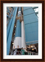 The Second Solid Rocket Motor is Moved into Place Alongside the Delta II First Stage Fine Art Print