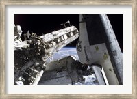 Space Shuttle Discovery Docked to the International Space Station Fine Art Print