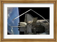 A Soyuz Vehicle and the Space Shuttle Discovery Docked to the International Space Station Fine Art Print