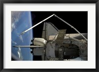 A Soyuz Vehicle and the Space Shuttle Discovery Docked to the International Space Station Fine Art Print
