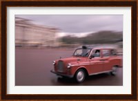 Cab racing past Buckingham Palace, London, England Fine Art Print