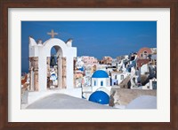 Bell tower and blue domes of church in village of Oia, Santorini, Greece Fine Art Print