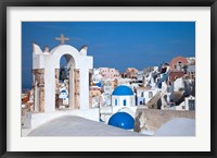 Bell tower and blue domes of church in village of Oia, Santorini, Greece Fine Art Print