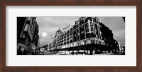 Low angle view of buildings lit up at night, Harrods, London, England BW Fine Art Print
