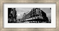 Low angle view of buildings lit up at night, Harrods, London, England BW Fine Art Print