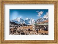Trekkers and yaks in Lobuche on a trail to Mt Everest Fine Art Print