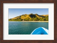 Blue boat cruising through the Yasawa, Fiji, South Pacific Fine Art Print