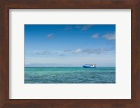 Fishing boat in the turquoise waters of the blue lagoon, Yasawa, Fiji, South Pacific Fine Art Print