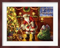 Santa putting gifts under tree Fine Art Print