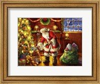 Santa putting gifts under tree Fine Art Print