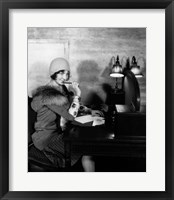 1920s  Woman With Pen To Lips Wearing Cloche Hat Fine Art Print