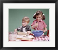 1960s  Boy And Girl Mixing Ingredients For Cookies Fine Art Print