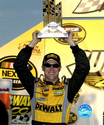 Framed Matt Kenseth holding Subway 400 trophy over his head Print