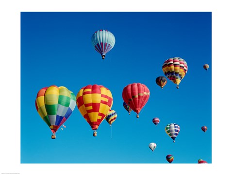 Framed Low angle view of a group of hot air balloons in the sky Print
