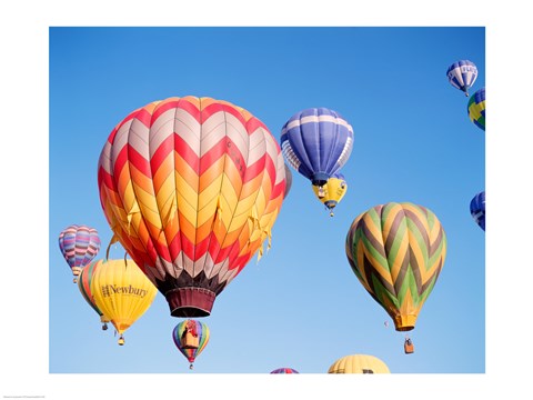 Framed Low angle view of hot air balloons in the sky Print