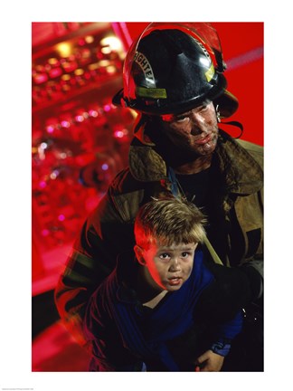 Framed Close-up of a firefighter carrying a boy Print