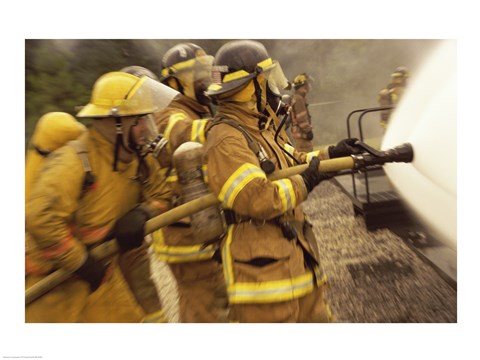 Framed Side profile of a group of firefighters holding water hoses Print