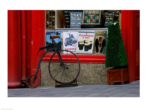 Framed Old bicycle in front of a store, Kilkenny, Ireland Print
