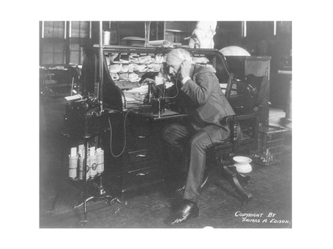 Framed Thomas Alva Edison using his dicatating machine Print