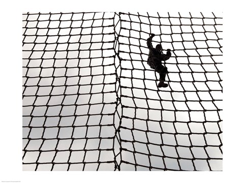 Framed Low angle view of a soldier climbing a rope net Print