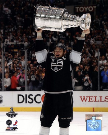 Framed Dustin Brown with the Stanley Cup Trophy after Winning Game 6 of the 2012 Stanley Cup Finals Print
