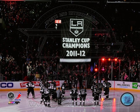 Framed Los Angeles Kings watch as their 2011-12 Championship Banner is raised Print