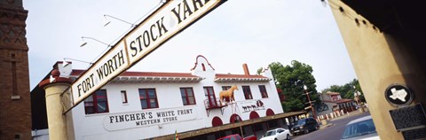 Framed Low angle view of a commercial signboard, Fort Worth Stockyards, Fort Worth, Texas, USA Print