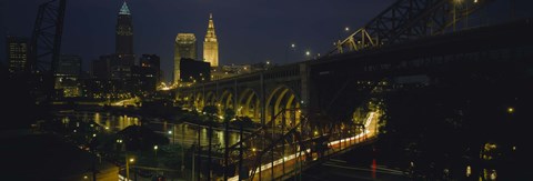 Framed Arch bridge and buildings lit up at night, Cleveland, Ohio, USA Print