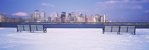Framed Park benches in snow with a city in the background, Lower Manhattan, Manhattan, New York City, New York State, USA Print