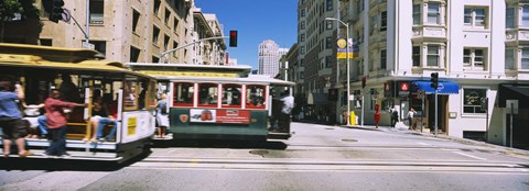 Framed Two cable cars on a road, Downtown, San Francisco, California, USA Print