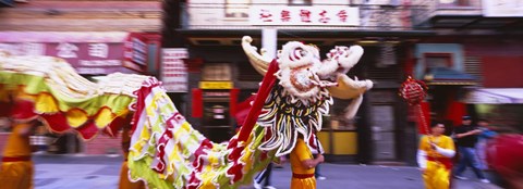 Framed Group of people performing dragon dancing on a road, Chinatown, San Francisco, California, USA Print
