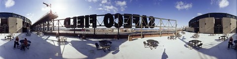 Framed Tourist sitting on a roof outside a baseball stadium, Seattle, King County, Washington State, USA Print
