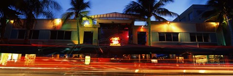Framed Traffic in front of a building at dusk, Art Deco District, South Beach, Miami Beach, Miami-Dade County, Florida, USA Print