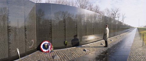 Framed Side profile of a person standing in front of a war memorial, Vietnam Veterans Memorial, Washington DC, USA Print