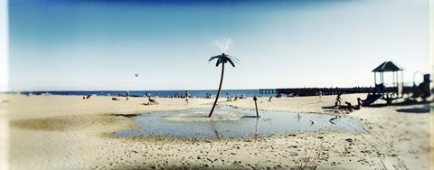 Framed Palm tree sprinkler on the beach, Coney Island, Brooklyn, New York City, New York State, USA Print